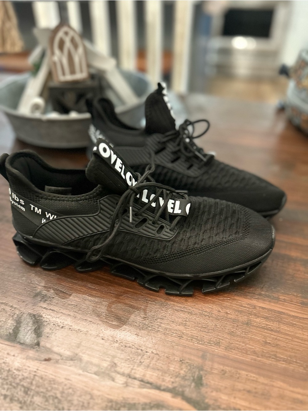 Black Athletic Lace-Up Sneakers with Bold White Logo Strap
